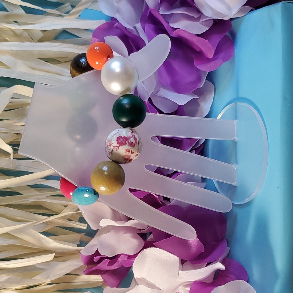 Multicolored  large to small beaded bracelet. Will match anything in your closet
